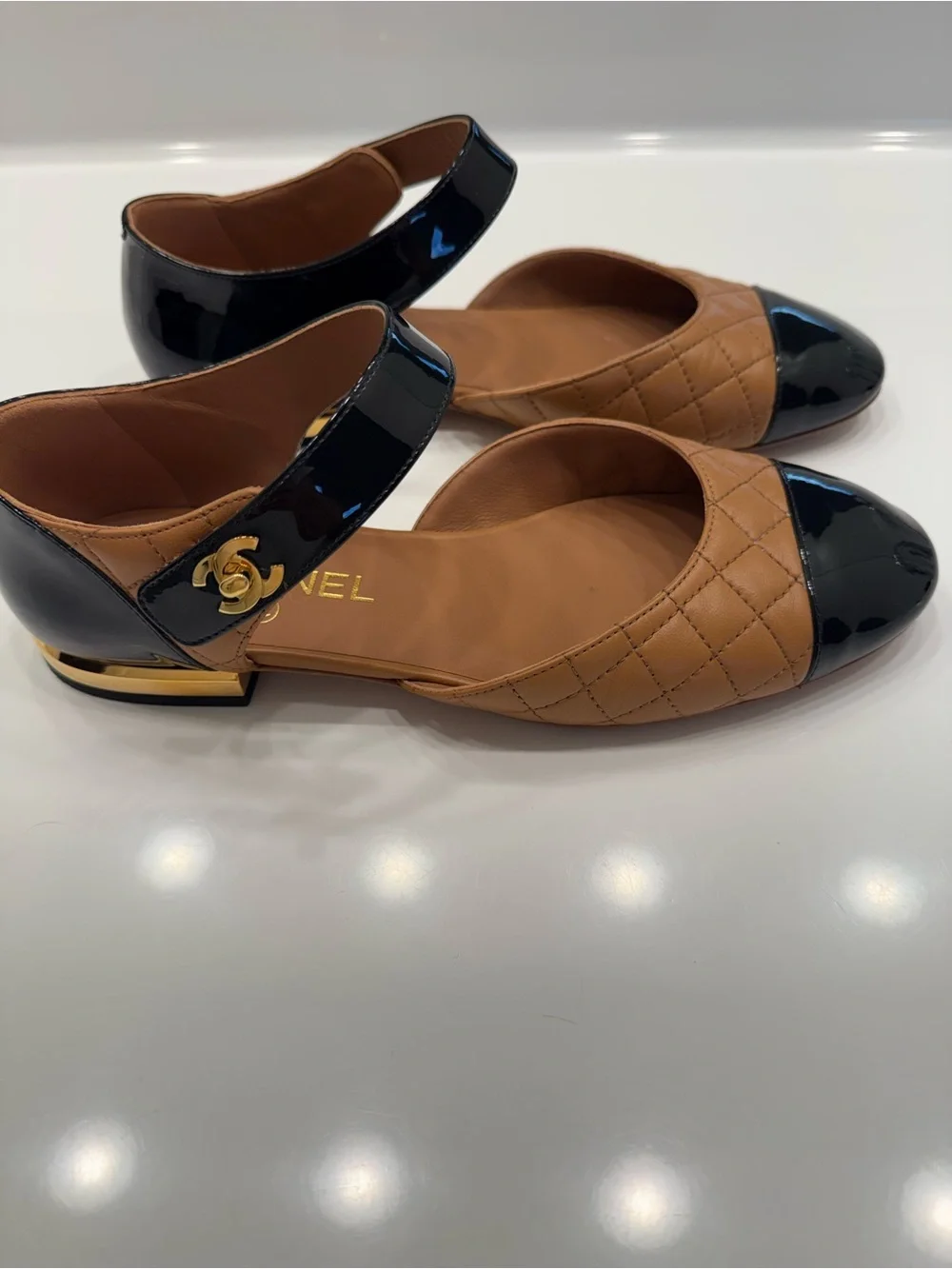 CHANEL Two-Tone Quilted Mary Jane Flats in Tan and Black IT38.5